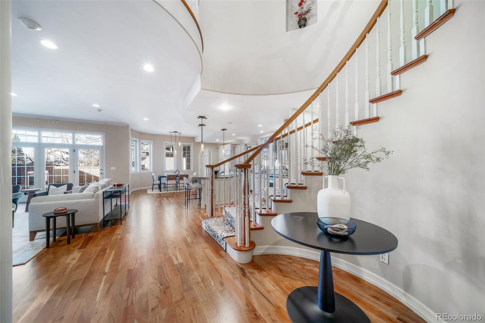 1425 South Elizabeth Street Denver, CO 80210 - Photo 5 of 50 a view of entryway and hall with wooden floor