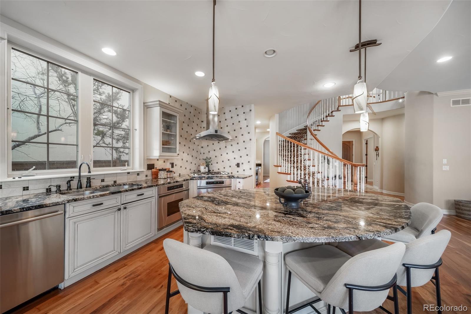 1425 South Elizabeth Street Denver, CO 80210 - Photo 10 of 50 a kitchen with lots of counter top space and dining table