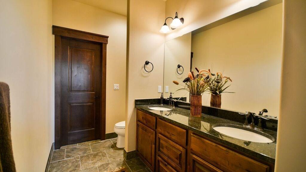 698 Independence Road, Unit 7A Keystone, CO 80435 - Photo 24 of 25 a bathroom with a granite countertop sink and a mirror