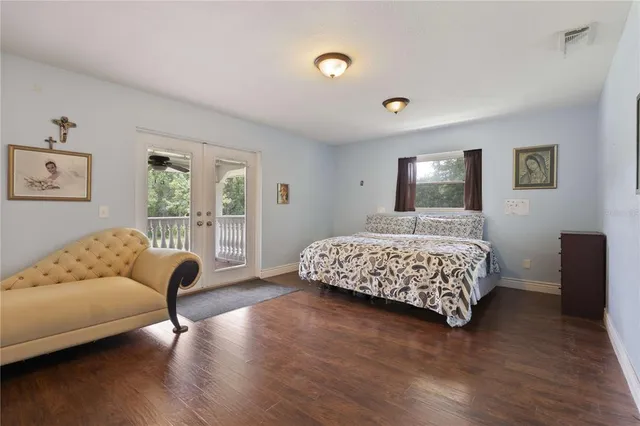 a bedroom with furniture and windows