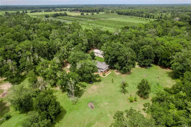 a aerial view of a house with a big yard