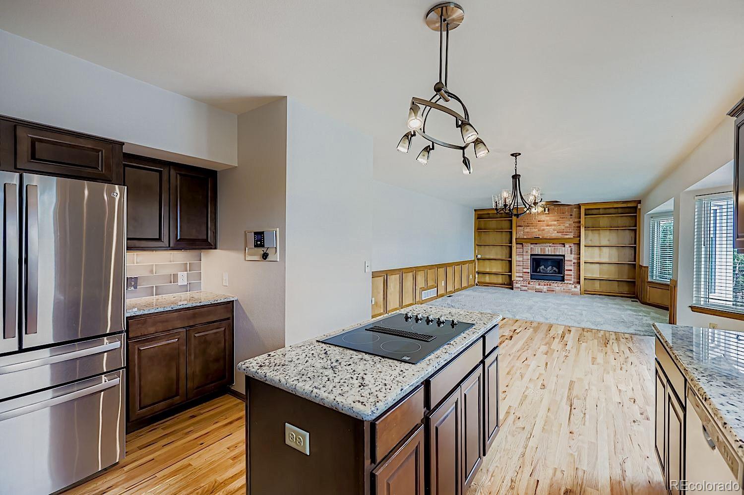 5825 Wilson Road Colorado Springs, CO 80919 - Photo 12 of 50 a kitchen with a stove and a refrigerator