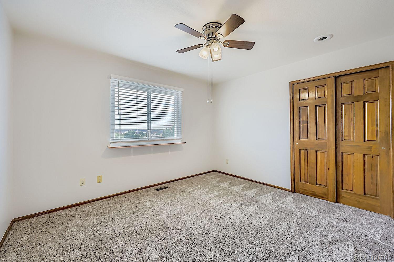 5825 Wilson Road Colorado Springs, CO 80919 - Photo 31 of 50 a view of an empty room with a window