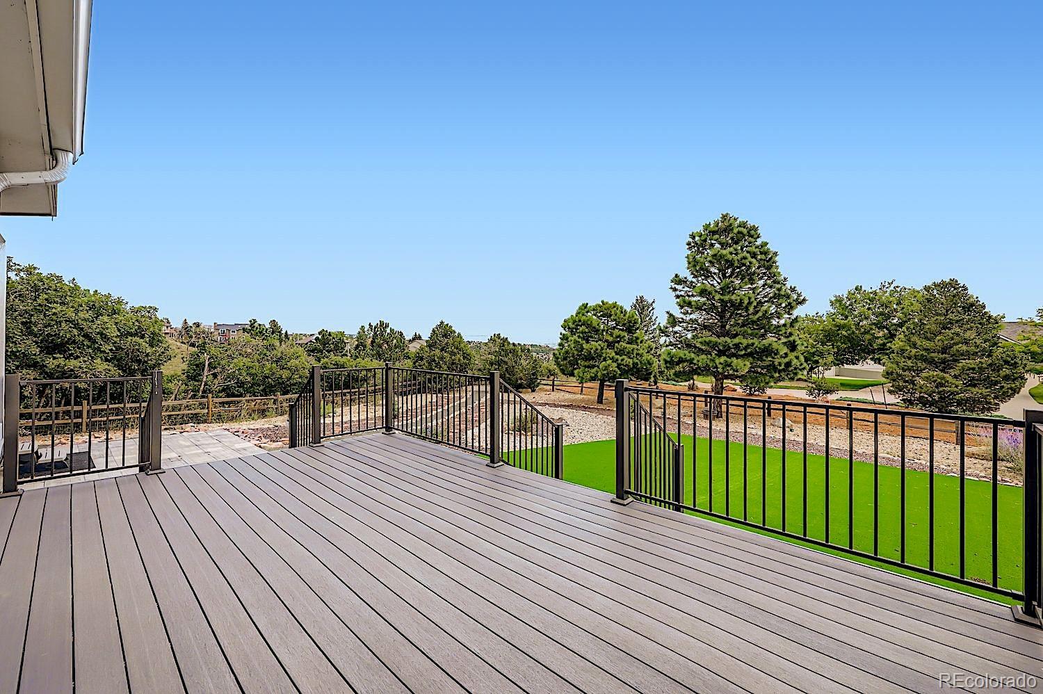5825 Wilson Road Colorado Springs, CO 80919 - Photo 45 of 50 a view of a deck with sunset view