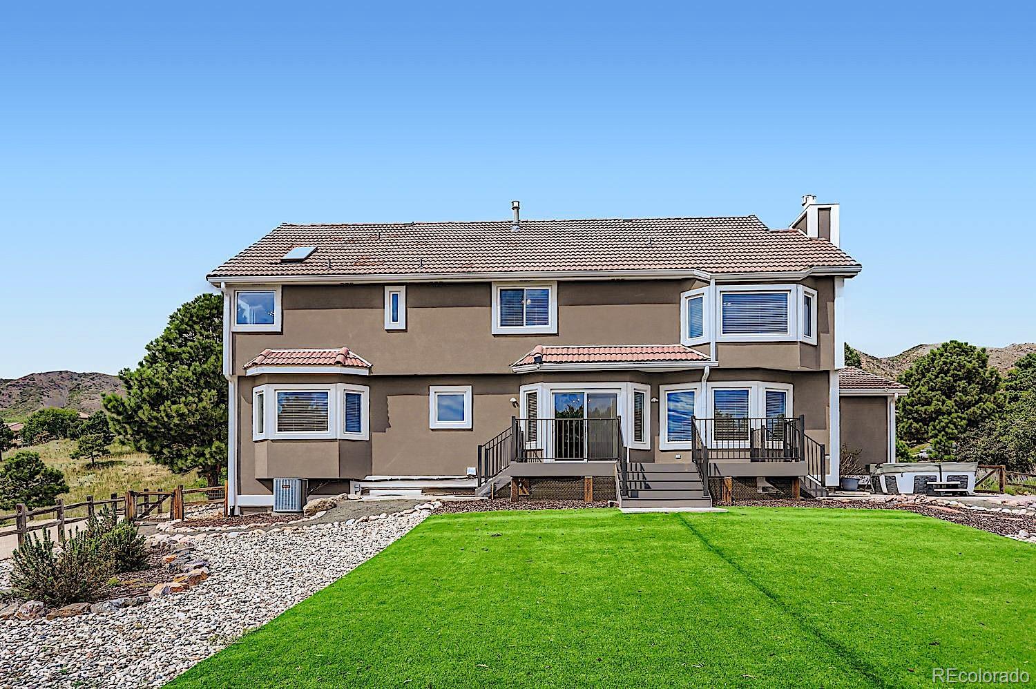 5825 Wilson Road Colorado Springs, CO 80919 - Photo 50 of 50 a front view of a house with a garden