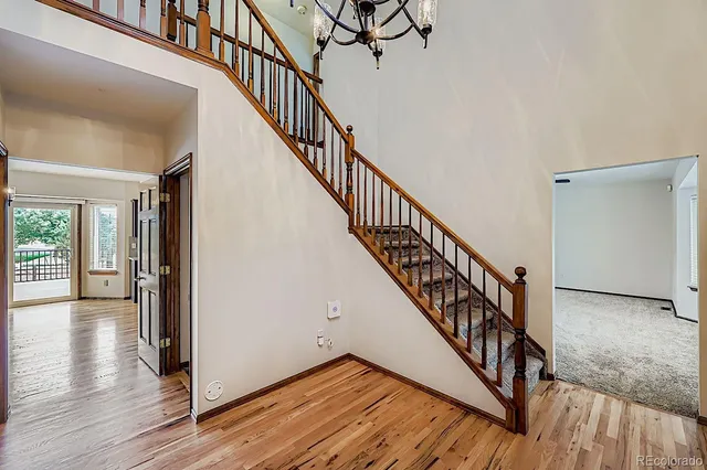 a view of staircase with wooden floor and stairs