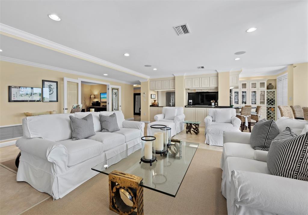 455 Longboat Club Road, Unit 402 Longboat Key, FL 34228 - Photo 4 of 48 a living room with furniture and view of kitchen