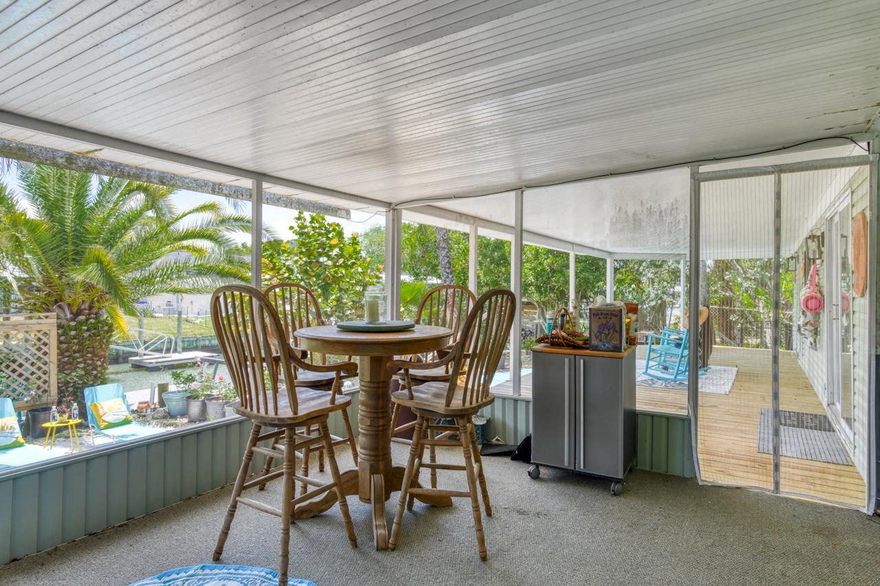231 Hildago Road St. Augustine, FL 32080 - Photo 19 of 49 a dining room with furniture and garden view
