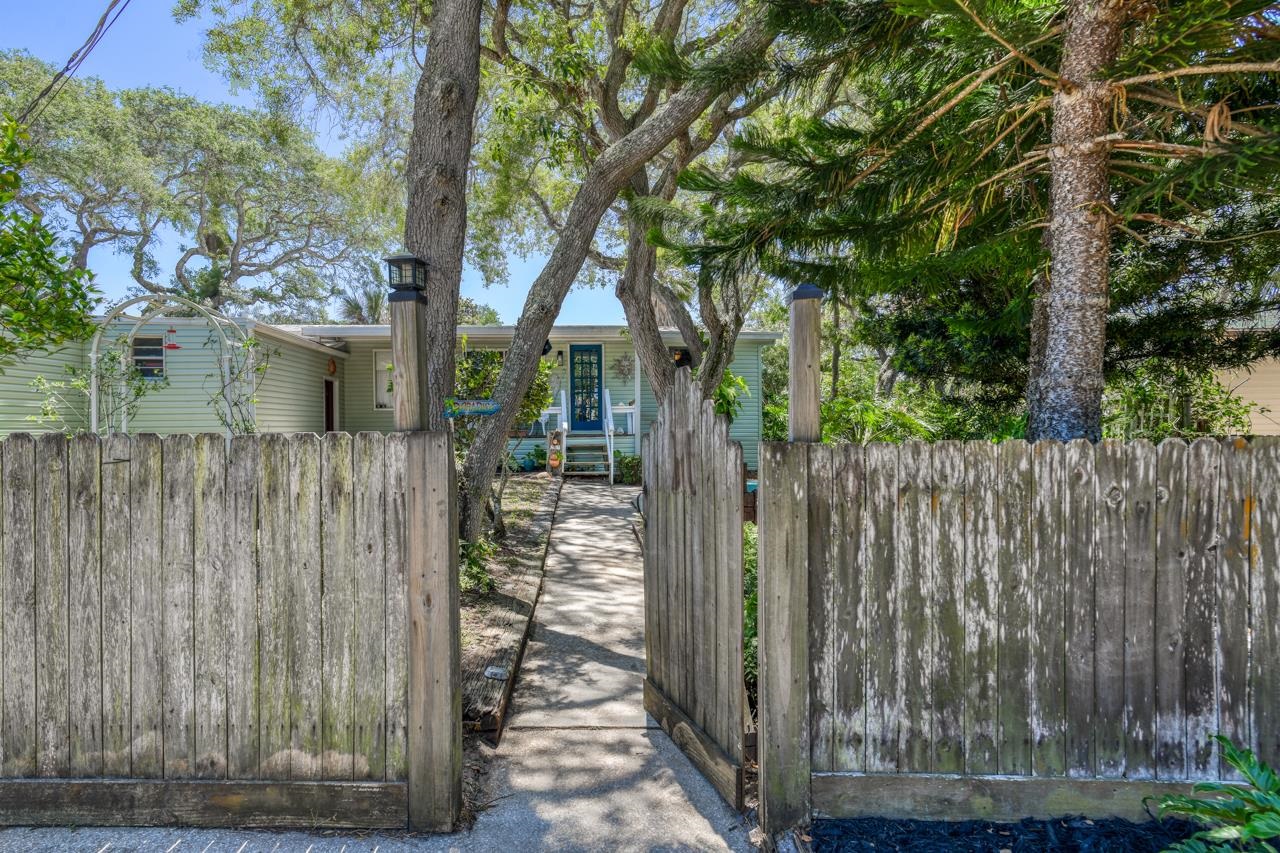 231 Hildago Road St. Augustine, FL 32080 - Photo 2 of 49 a view of a house with a wooden fence