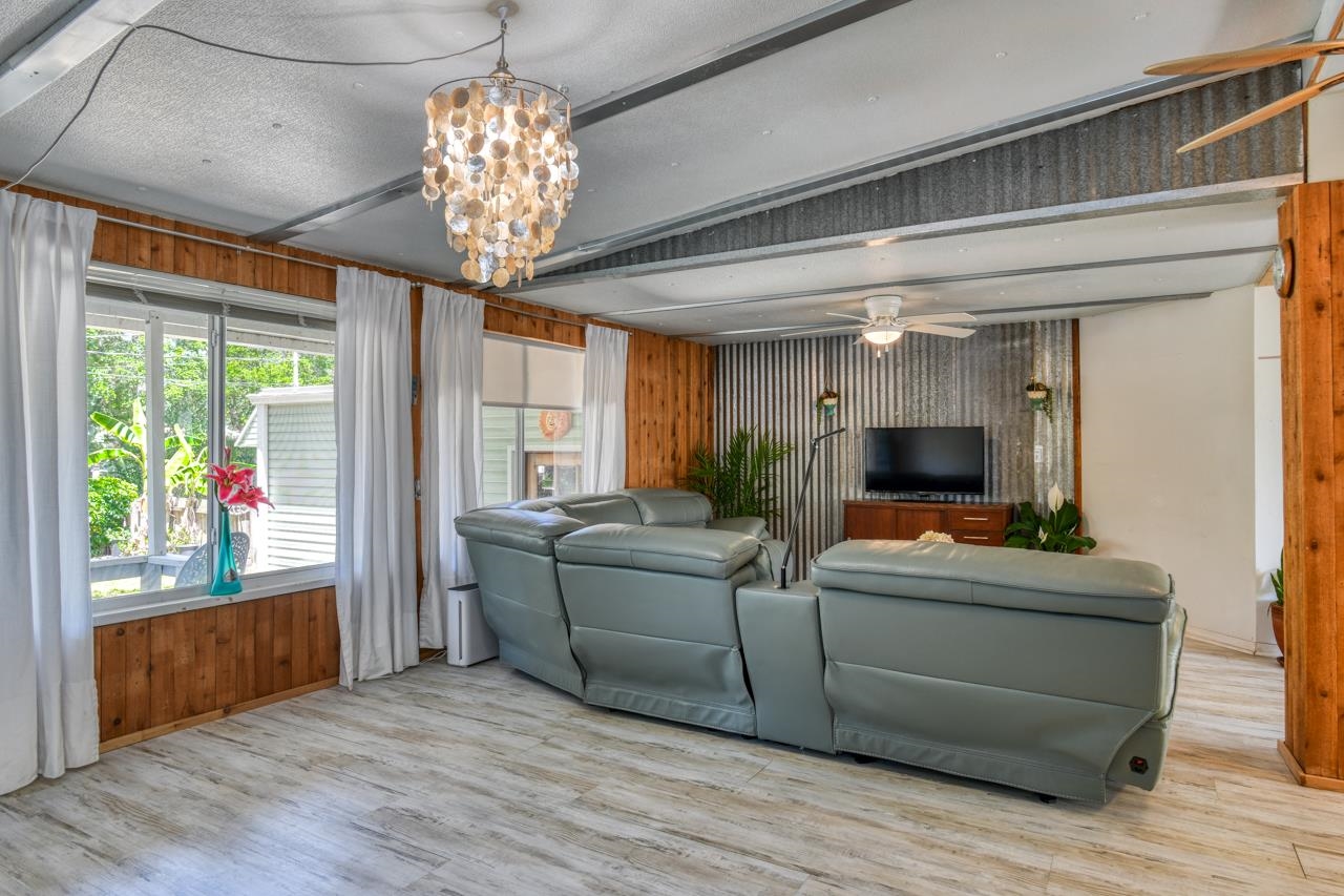231 Hildago Road St. Augustine, FL 32080 - Photo 21 of 49 a living room with furniture and a chandelier