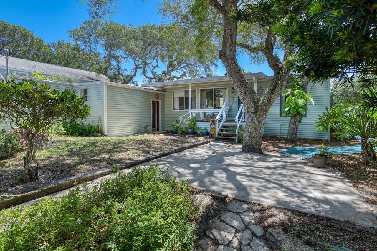 231 Hildago Road St. Augustine, FL 32080 - Photo 3 of 49 a view of a house with a tree in front of it