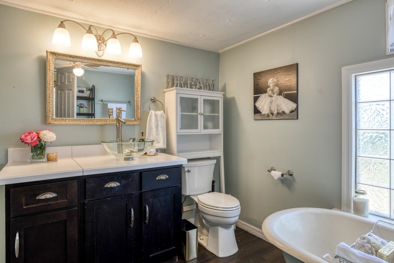 231 Hildago Road St. Augustine, FL 32080 - Photo 32 of 49 a bathroom with a toilet a sink and mirror