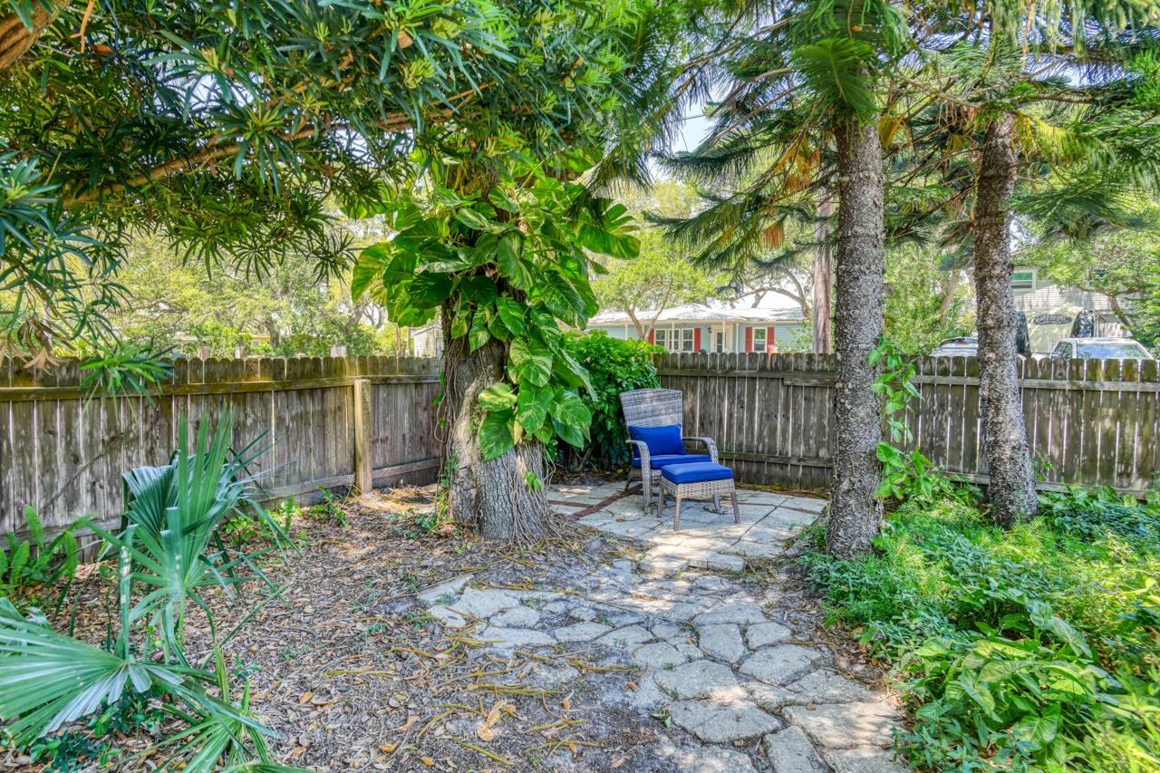 231 Hildago Road St. Augustine, FL 32080 - Photo 4 of 49 a view of a table and chairs in the back yard of a house
