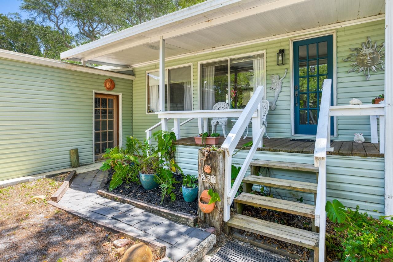 231 Hildago Road St. Augustine, FL 32080 - Photo 8 of 49 a front view of a house with stairs