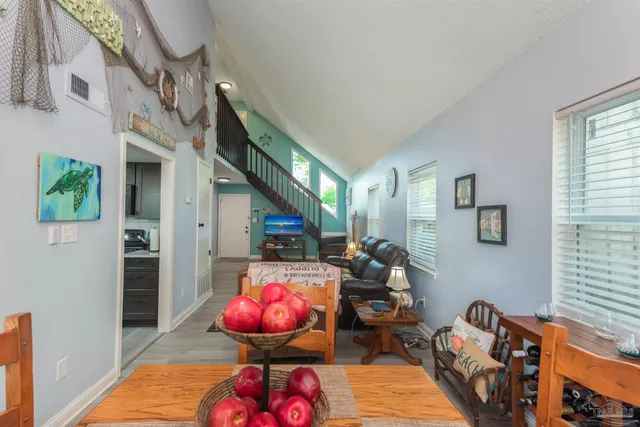 a bedroom with furniture and a window