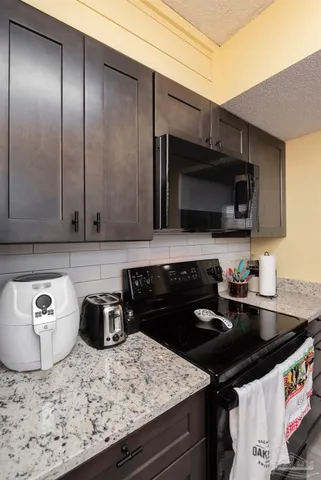 a kitchen with a sink and stove