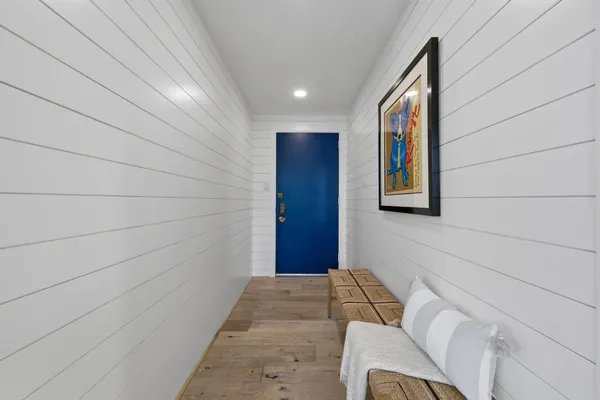 a bedroom with a bed and a walk in closet