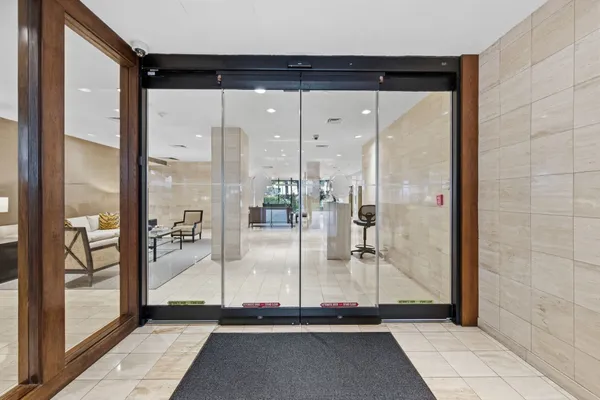 a bathroom with a glass shower door