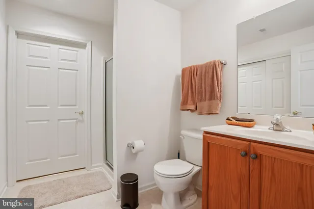 a bathroom with a sink toilet and mirror