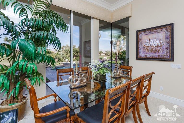 265 Loch Lomond Road Rancho Mirage, CA 92270 - Photo 15 of 46 a view of a dinning room with furniture and floor to ceiling window