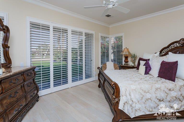 265 Loch Lomond Road Rancho Mirage, CA 92270 - Photo 16 of 46 a bedroom with a bed and a dresser