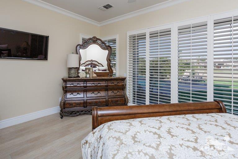 265 Loch Lomond Road Rancho Mirage, CA 92270 - Photo 17 of 46 a bedroom with a bed and a television