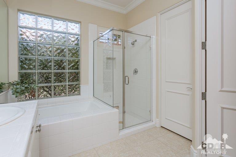 265 Loch Lomond Road Rancho Mirage, CA 92270 - Photo 19 of 46 a bathroom with a bathtub and shower