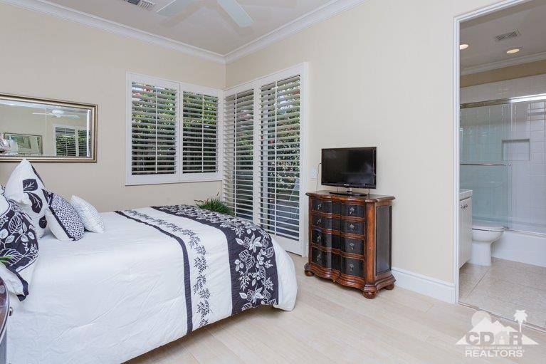 265 Loch Lomond Road Rancho Mirage, CA 92270 - Photo 21 of 46 a bedroom with a bed and a flat screen tv