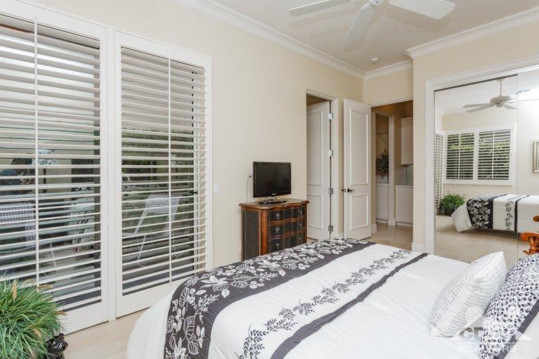 265 Loch Lomond Road Rancho Mirage, CA 92270 - Photo 22 of 46 a bedroom with a bed and a television