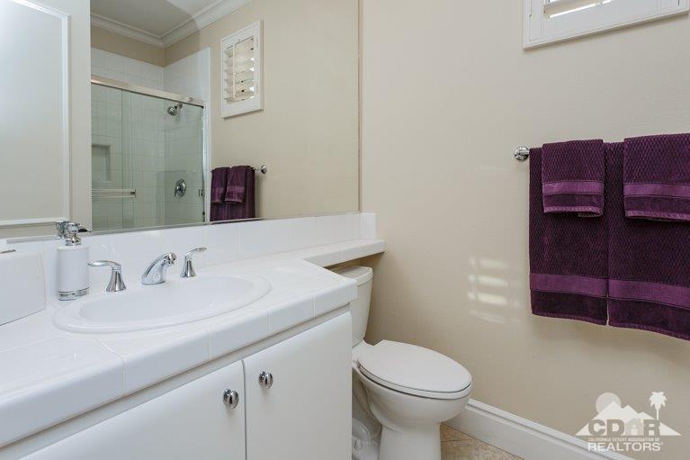 265 Loch Lomond Road Rancho Mirage, CA 92270 - Photo 26 of 46 a bathroom with a sink a toilet and shower
