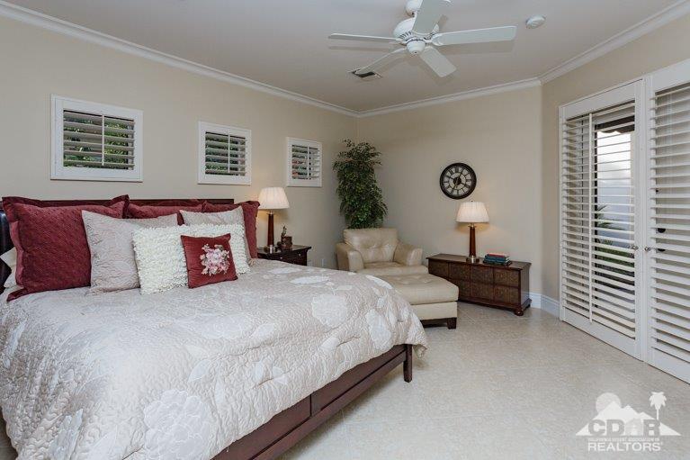265 Loch Lomond Road Rancho Mirage, CA 92270 - Photo 28 of 46 a bedroom with bed and a window