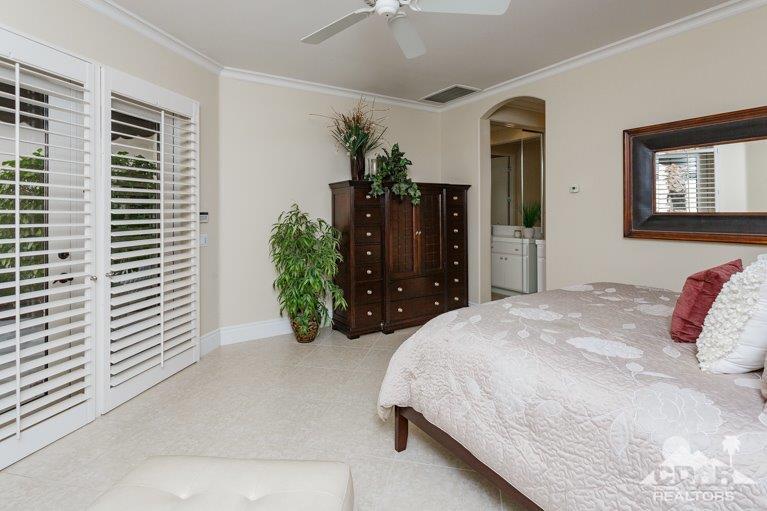 265 Loch Lomond Road Rancho Mirage, CA 92270 - Photo 29 of 46 a bedroom with a bed dresser and mirror