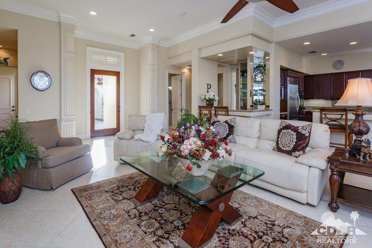 265 Loch Lomond Road Rancho Mirage, CA 92270 - Photo 4 of 46 a living room with furniture potted plant and a large window