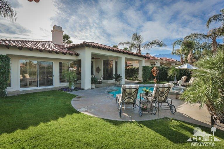 265 Loch Lomond Road Rancho Mirage, CA 92270 - Photo 34 of 46 front view of a house with a yard