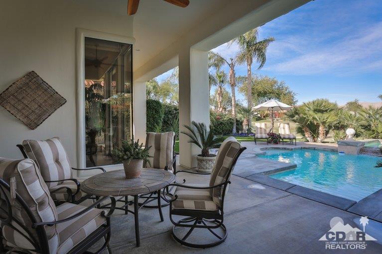 265 Loch Lomond Road Rancho Mirage, CA 92270 - Photo 36 of 46 a view of a dining table and chairs in the patio