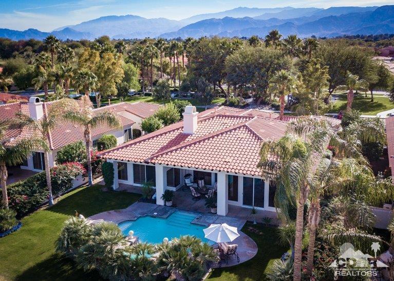 265 Loch Lomond Road Rancho Mirage, CA 92270 - Photo 38 of 46 a view of a house with a yard and a swimming pool