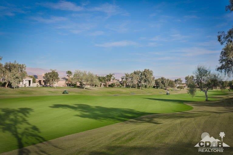 265 Loch Lomond Road Rancho Mirage, CA 92270 - Photo 42 of 46 a view of a golf course with a lake