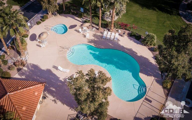 265 Loch Lomond Road Rancho Mirage, CA 92270 - Photo 46 of 46 an aerial view of a swimming pool with a yard and mountain view