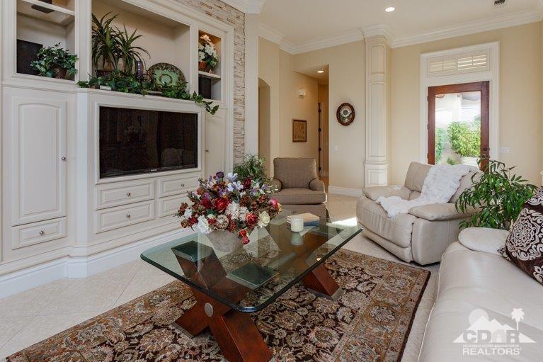 265 Loch Lomond Road Rancho Mirage, CA 92270 - Photo 6 of 46 a living room with furniture and a flat screen tv