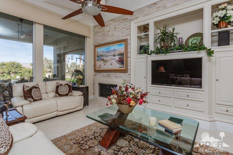 265 Loch Lomond Road Rancho Mirage, CA 92270 - Photo 7 of 46 a living room with furniture and a fireplace