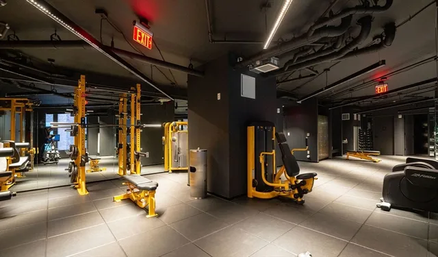 a view of a gym with gym equipment