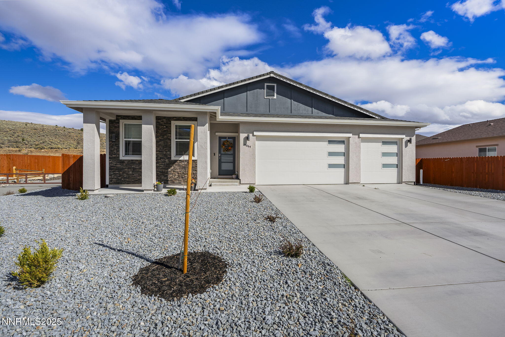 19064 Bronco Crk Court Reno, NV 89508 - Photo 2 of 20 a front view of a house with a yard