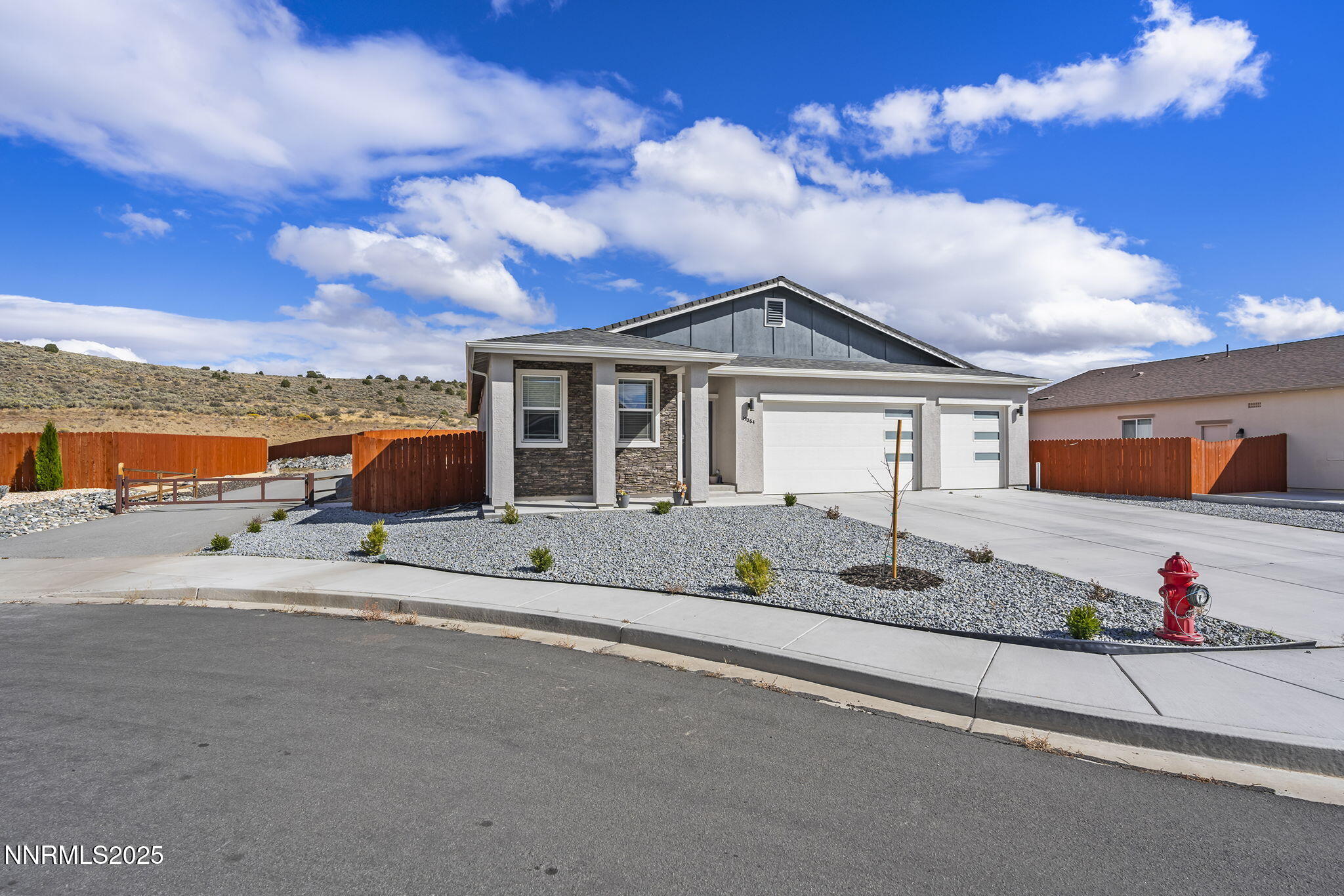 19064 Bronco Crk Court Reno, NV 89508 - Photo 3 of 20 a front view of a house with a yard