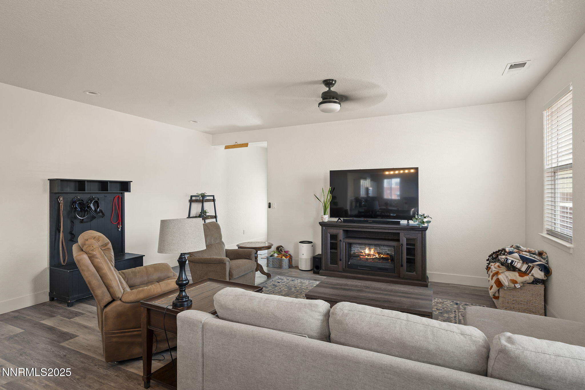 19064 Bronco Crk Court Reno, NV 89508 - Photo 6 of 20 a living room with furniture and a flat screen tv