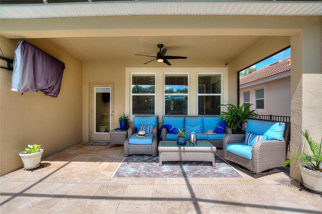 1089 Blackwolf Run Road Davenport, FL 33896 - Photo 43 of 82 a living room with furniture and flowers