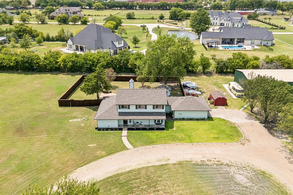 5 Orchard Road Lucas, TX 75002 - Photo 30 of 34 Expansive property featuring a two-story home with a light-colored exterior and dark shingle roof