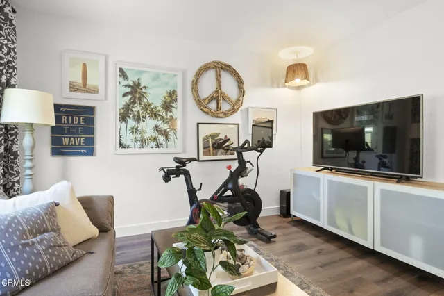 a view of living room with furniture and a flat screen tv