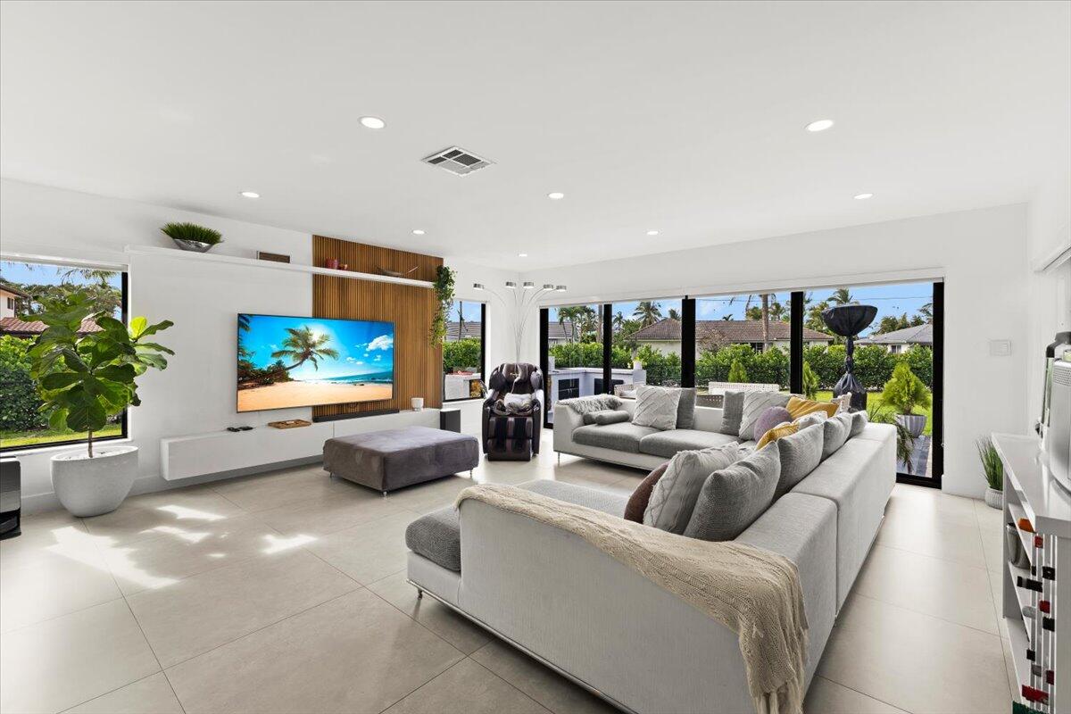 1049 West Palmetto Park Road Boca Raton, FL 33486 - Photo 14 of 40 a living room with furniture fireplace and a large window