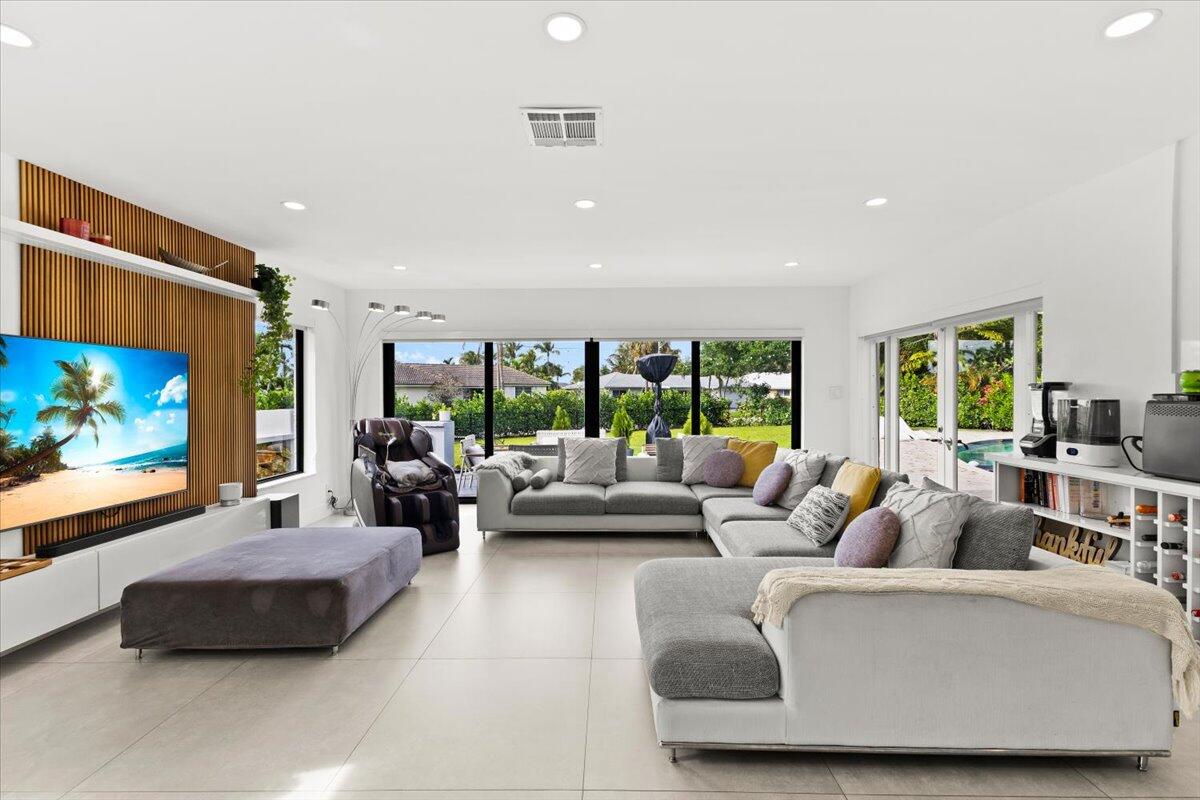 1049 West Palmetto Park Road Boca Raton, FL 33486 - Photo 15 of 40 a living room with furniture and a flat screen tv