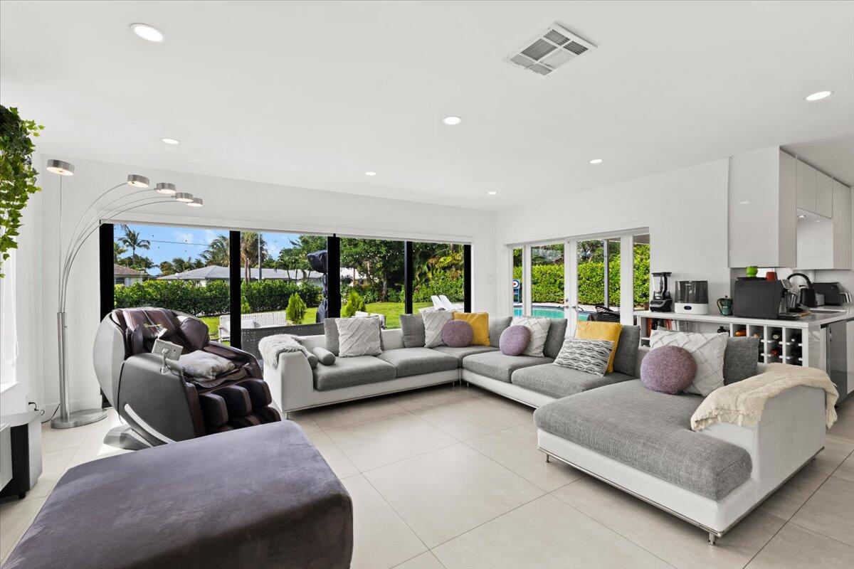 1049 West Palmetto Park Road Boca Raton, FL 33486 - Photo 16 of 40 a living room with furniture and a large window